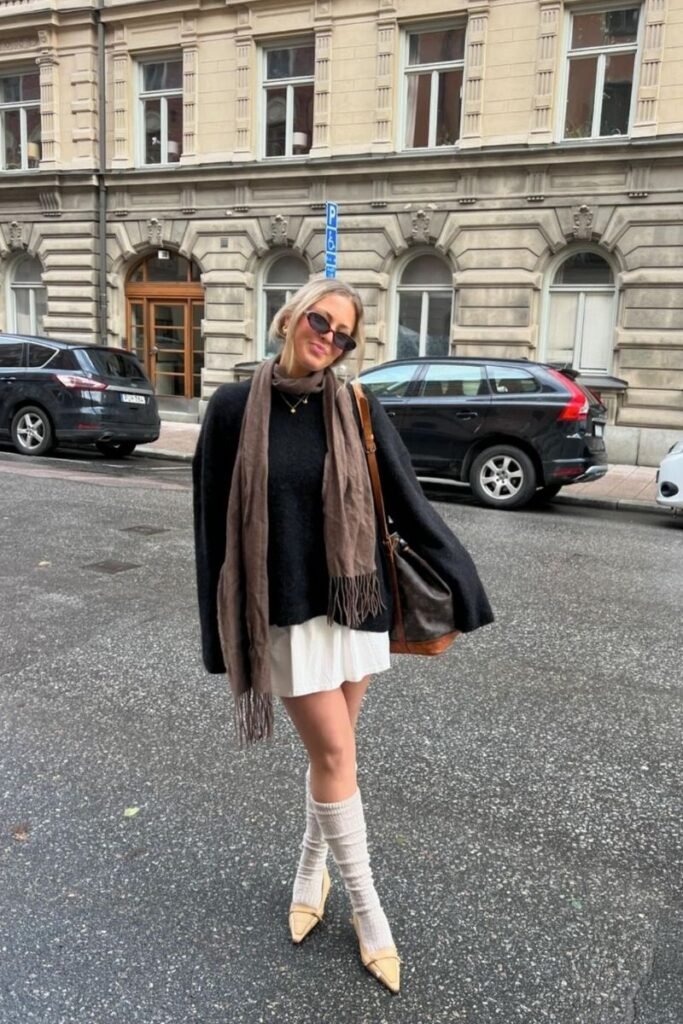 Black Oversized Sweater White Mini Skirt Beige Pointed Toe Flats Chunky Leg Warmers