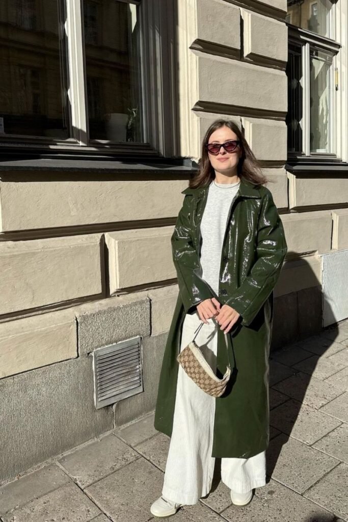Grey Sweatshirt with Wide Legged White Pants and Glossy Green Trench Coat