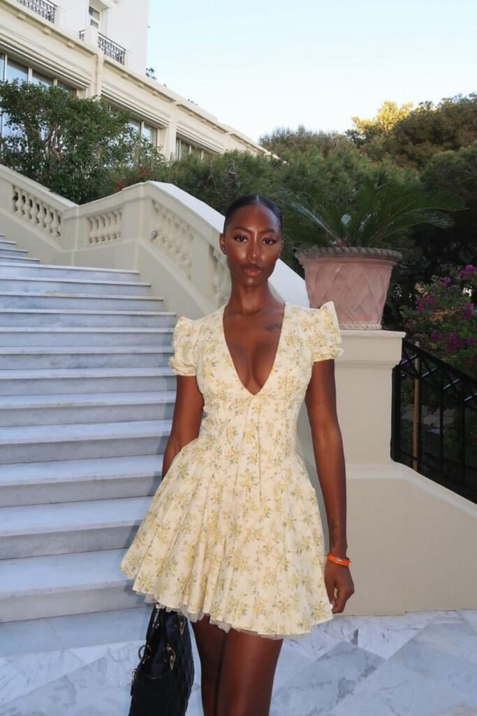 Yellow floral dress with a deep V neckline puffed sleeves